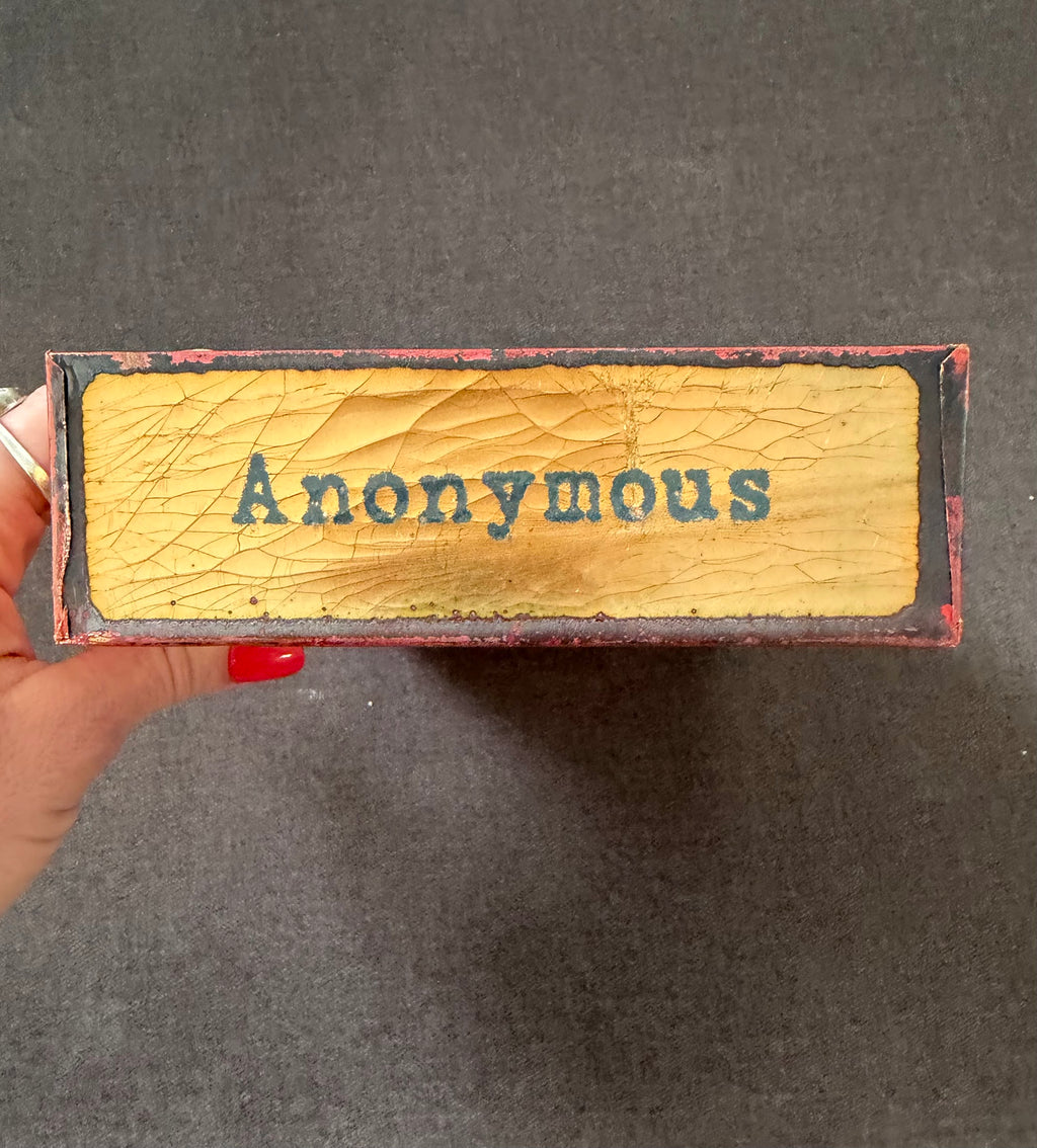 Top edge panel reading Anonymous in gold lettering