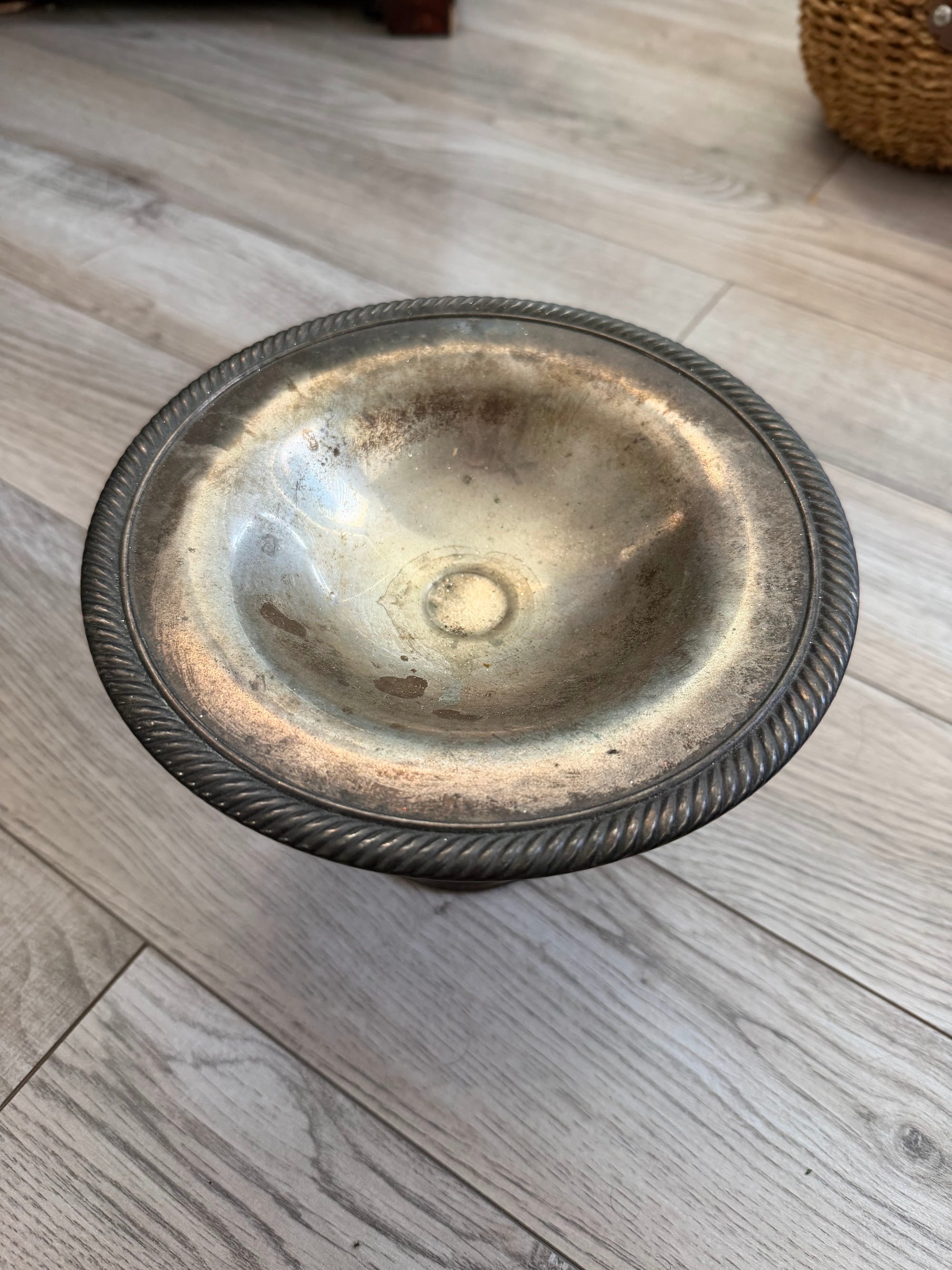 Top view of silverplate compote bowl showing gadroon rim and patina