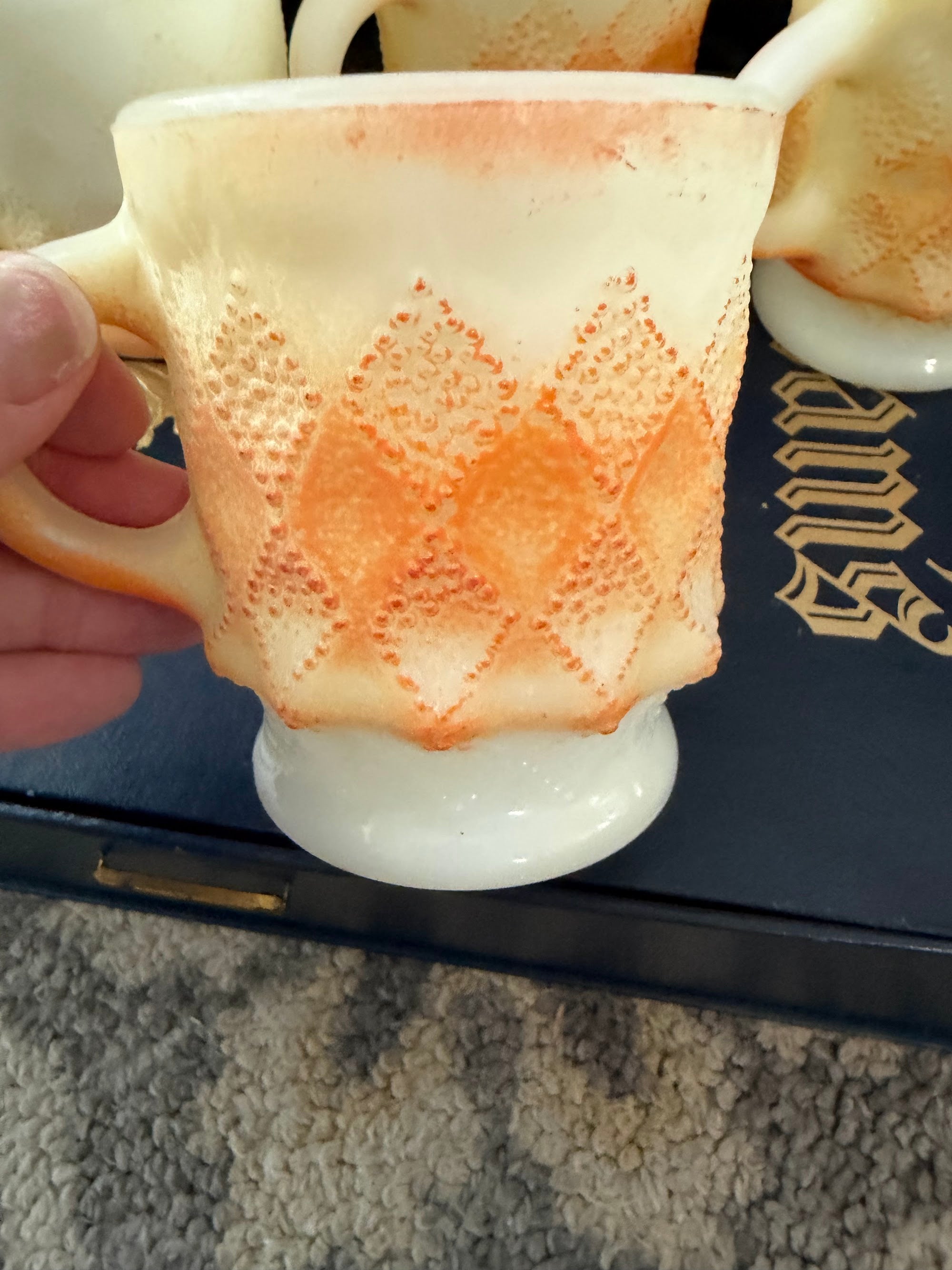 Close-up of raised diamond pattern on single mug