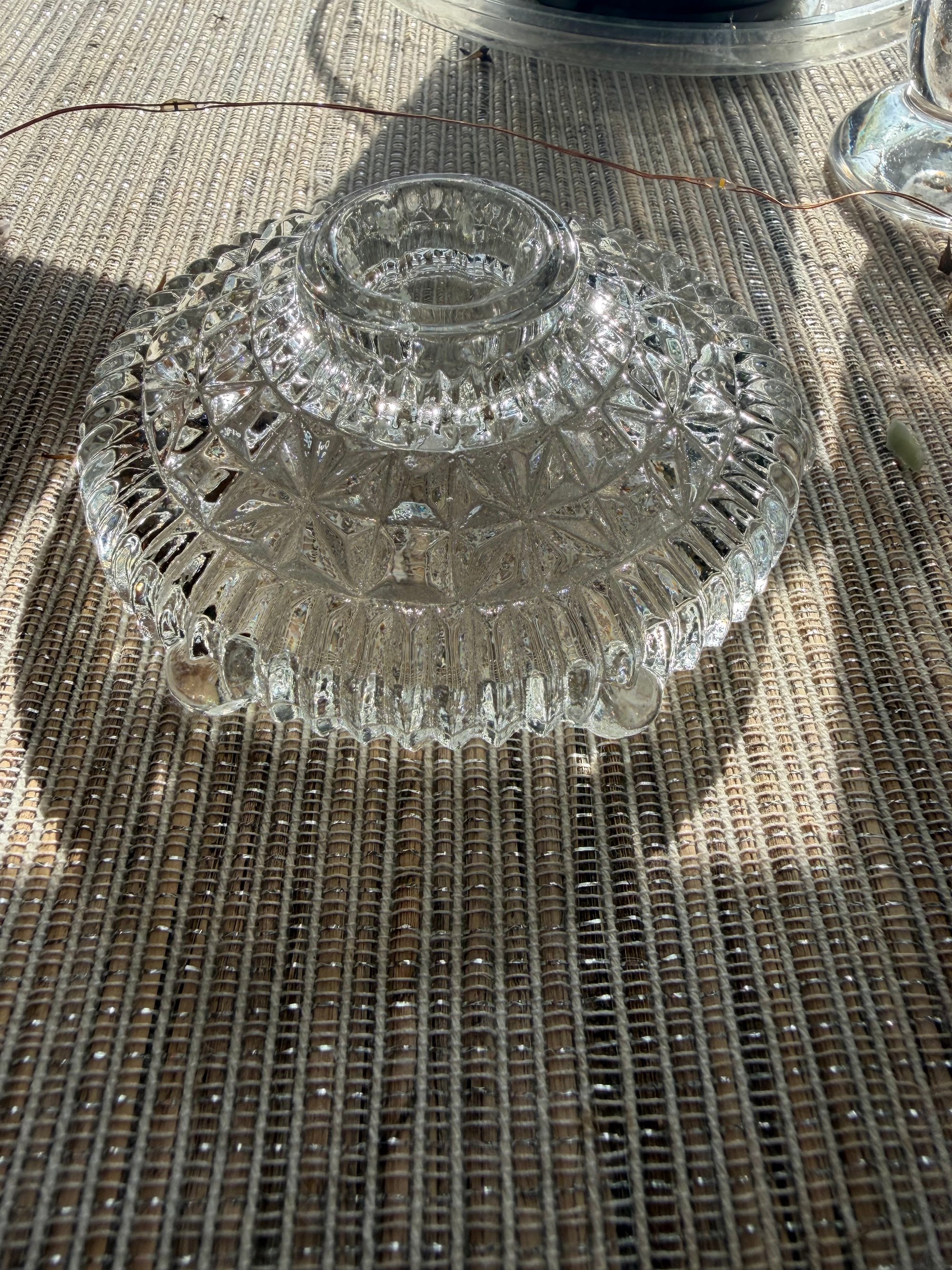 Angled view showing candle cup and scalloped skirt