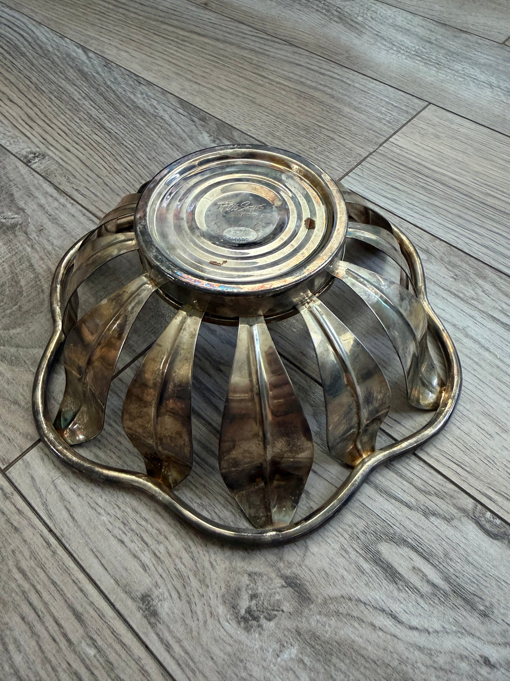 Side underside view showing petal construction and patina