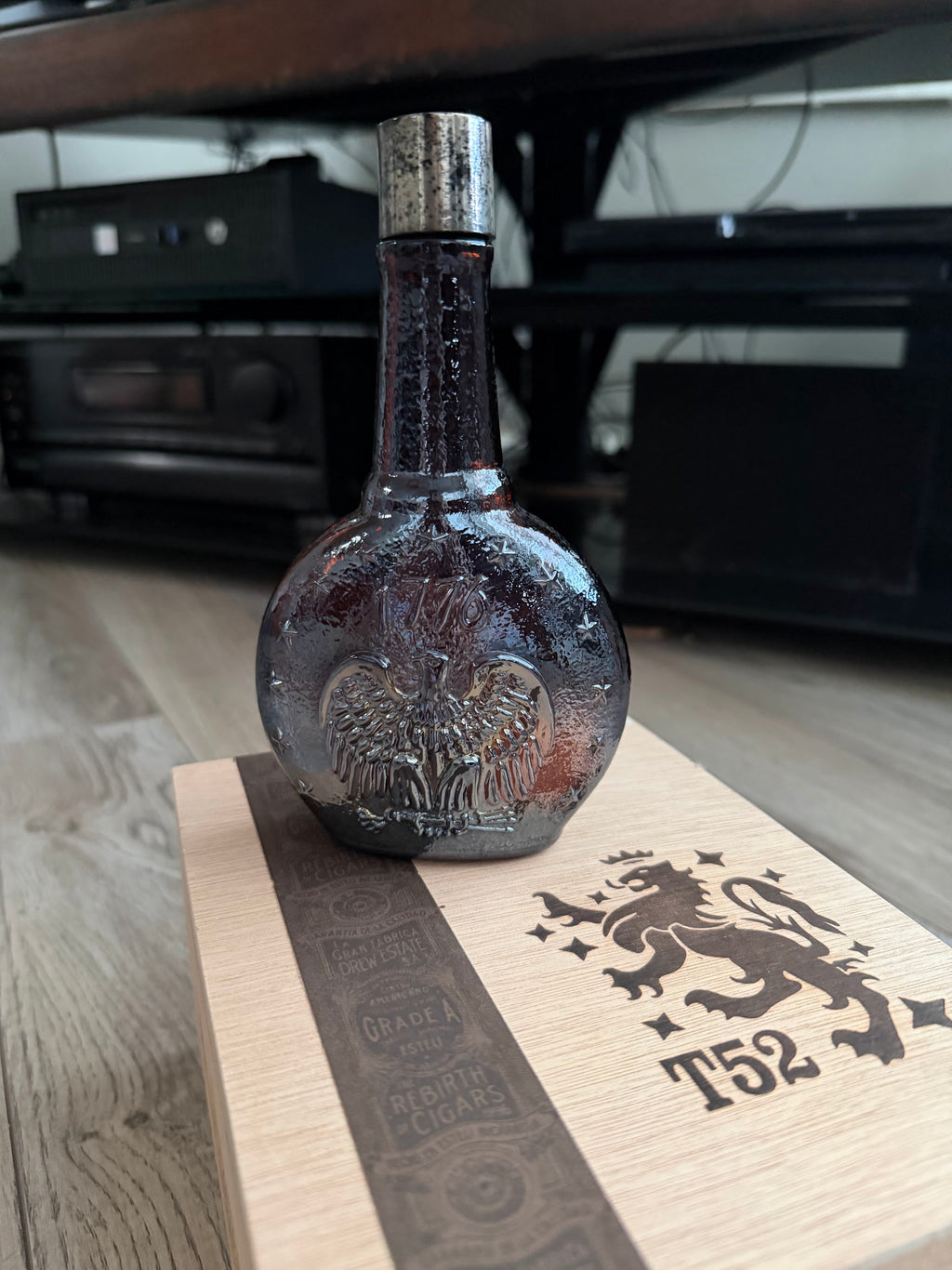 Amber decanter bottle with embossed spread eagle, front view