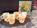 Set of five Fire-King Kimberly diamond mugs in peach lustre