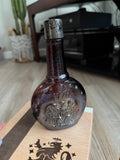 Vintage Aqua Velva 1776 eagle amber glass bottle, full view